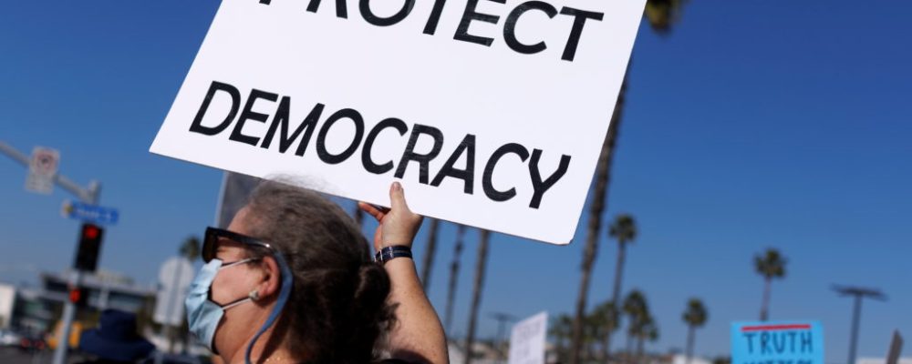 A protest for democracy is held to mark the first anniversary of the January 6, 2021 attack on the U.S. Capitol by supporters of former President Donald Trump in San Diego, California, U.S., January 6, 2022. REUTERS/Mike Blake