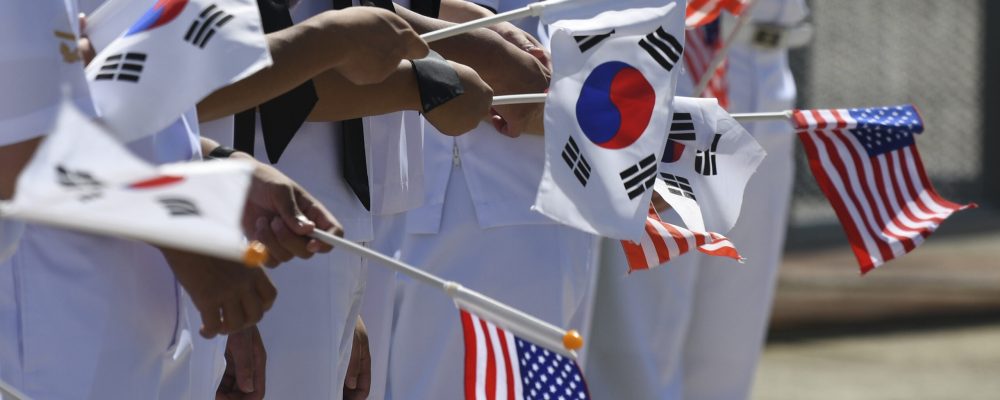 BUSAN, Republic of Korea (Sept. 23, 2022) Republic of Korea (ROK) Navy Sailors wave ROK and United States flags during a port visit for the U.S. Navy’s only forward-deployed aircraft carrier USS Ronald Reagan (CVN 76) in Busan, Republic of Korea, Sept. 23. Ronald Reagan, the flagship of Carrier Strike Group (CSG) 5, provides a combat-ready force that protects and defends the United States, and supports alliances, partnerships and collective maritime interests in the Indo-Pacific region. (U.S. Navy photo by Mass Communication Specialist 2nd Class Leon Wong)