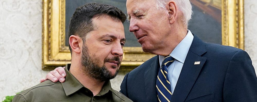 FILE PHOTO: Ukrainian President Volodymyr Zelenskiy is embraced by U.S. President Joe Biden in the Oval Office of the White House in Washington, September 21, 2023. REUTERS/Kevin Lamarque/File Photo