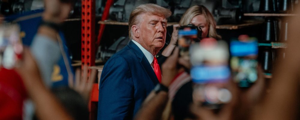 Former President Donald Trump arrives to speak to a group of 500 guests, including some United Auto Workers Union members, at Drake Enterprises in Clinton Township, Michigan, on September 27, 2023. Trump is skipping the second Republican debate to speak at Drake Enterprises, a non-union auto parts plant, amidst the thirteenth day of the UAW strike against the major U.S. carmakers.