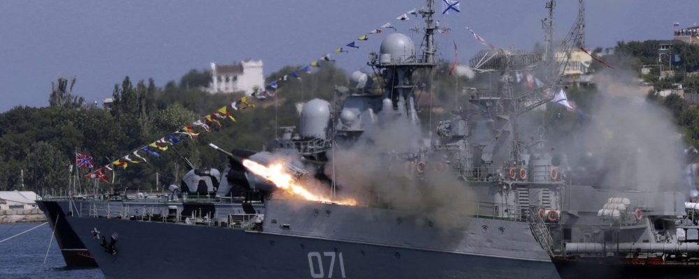 A Russian Navy ship fires missiles during Navy Day celebrations in the Crimean city of Sevastopol on July 26, 2015. AFP PHOTO / MAX VETROV        (Photo credit should read MAX VETROV/AFP via Getty Images)