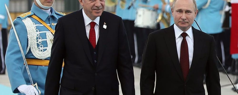 The President of Turkey Recep Tayyip Erdogan and his Russian counterpart Russia's Vladimir Putin (R) review the honour guard at the Presidential Complex in Ankara on April 3, 2018.  
President Vladimir Putin arrived for a visit to Russia's increasingly close partner Turkey aimed at launching the construction of a nuclear power plant and coordinating policy on the war in Syria. / AFP PHOTO / ADEM ALTAN