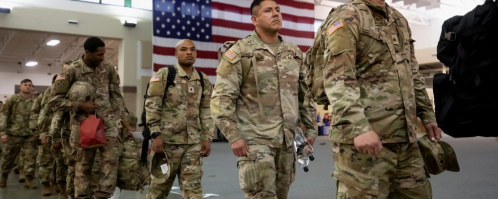 U.S. Army soldiers from B Company, of the Division Sustainment Support Battalion, 3rd Division Sustainment Brigade, wait in a staging area before boarding a transport plane bound for Europe on a deployment launched in response to the invasion of Ukraine by Russia, at Hunter Army Airfield in Savannah, Georgia, U.S., March 11, 2022.  REUTERS/Sam Wolfe