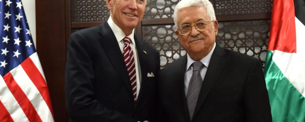 US Vice President Joe Biden, left, and Palestinian President Mahmoud Abbas, shake hands for the press at the presidential compound in Ramallah, West Bank, Wednesday, March 9, 2016. (Debbie Hill, Pool via AP)