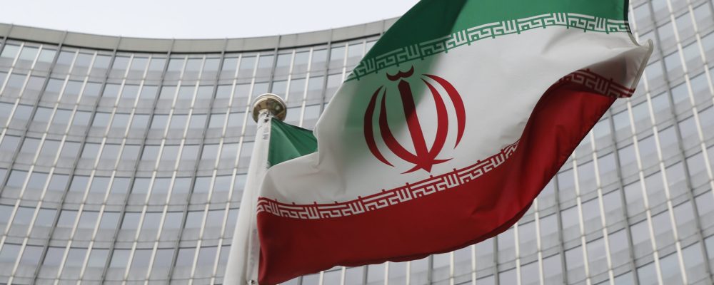 FILE PHOTO: An Iranian flag flutters in front of the International Atomic Energy Agency (IAEA) headquarters in Vienna, Austria, January 15, 2016.   REUTERS/Leonhard Foeger