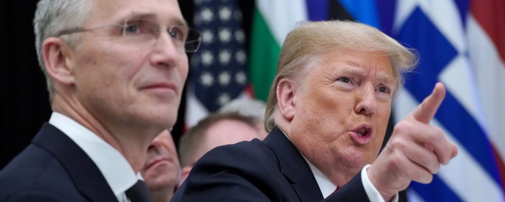 FILE PHOTO: U.S. President Donald Trump gestures next to NATO Secretary General Jens Stoltenberg as they attend a working lunch during the NATO leaders summit in Watford, Britain, December 4, 2019. REUTERS/Kevin Lamarque