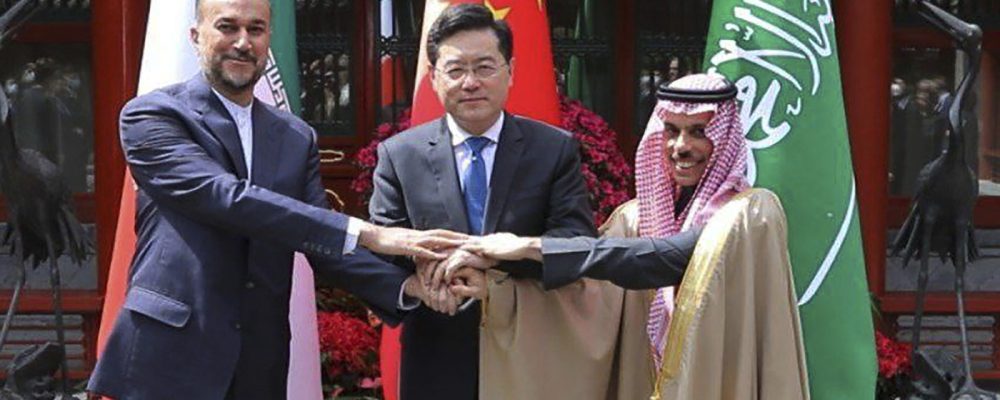 In this picture released by the Iranian Foreign Ministry, Iran's Foreign Minister Hossein Amirabdollahian, left, shakes hands with his Saudi Arabian counterpart Prince Faisal bin Farhan Al Saud, right, and Chineses counterpart Qin Gang in Beijing Thursday, April 6, 2023. (Iranian Foreign Ministry via AP)