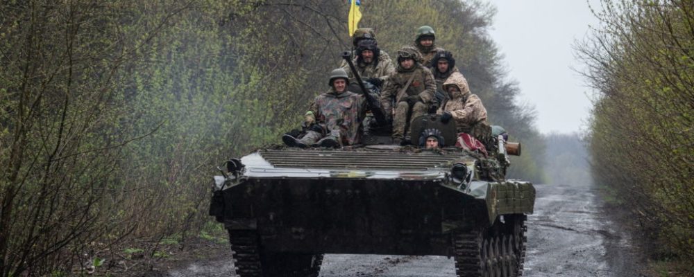 Ukrainian servicemen ride atop an armoured fighting vehicle, as Russia?s attack on Ukraine continues, at an unknown location in Eastern Ukraine, in this handout picture released April 19, 2022.  Press service of the Ukrainian Ground Forces/Handout via REUTERS THIS IMAGE HAS BEEN SUPPLIED BY A THIRD PARTY.