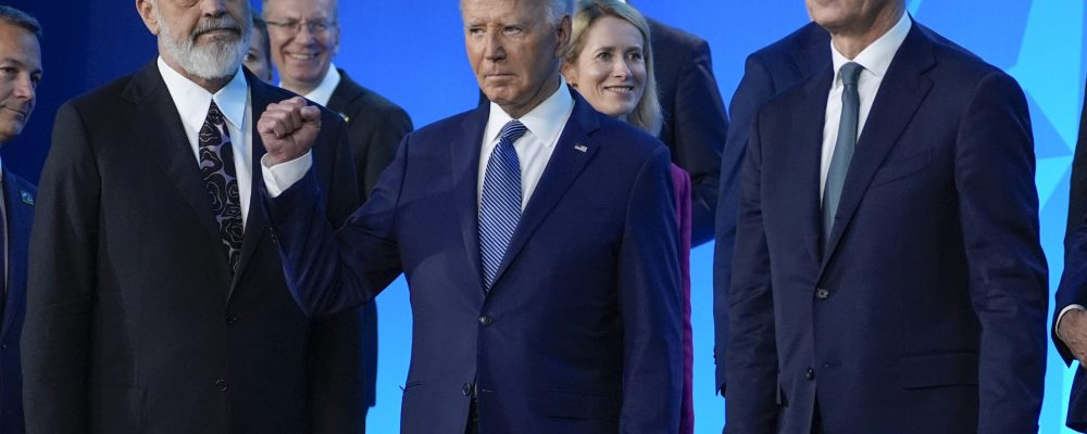 President Joe Biden, center, gestures with Albania's Prime Minister Edi Rama, left, and NATO Secretary General Jens Stoltenberg, right, after a family photo at the NATO Summit, Wednesday, July 10, 2024, in Washington. (AP Photo/Evan Vucci)