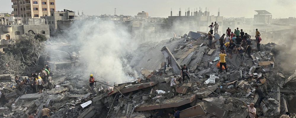 Palestinians look for survivors following Israeli airstrike in Nusseirat refugee camp, Gaza Strip, Tuesday, Oct. 31, 2023. (AP Photo/Doaa AlBaz)