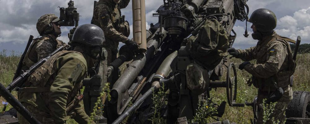 FILE - Ukrainian servicemen prepare to fire at Russian positions from a U.S.-supplied M777 howitzer in Kharkiv region, Ukraine, July 14, 2022. U.S. officials say the Pentagon will announce it is sending up to $500 million in military aid to Ukraine, including more than 50 heavily armored vehicles and an infusion of missiles for air defense systems. The aid comes as Ukrainian and Western leaders try to sort out the impact of the brief weekend revolt against the Russian military. (AP Photo/Evgeniy Maloletka, File)